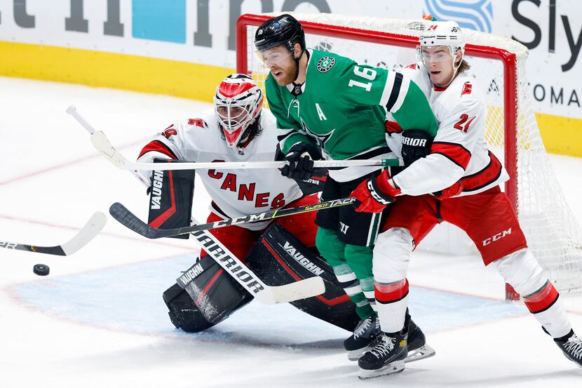 Dallas Stars center Joe Pavelski (16) gets squeezed out by Carolina Hurricanes goaltender...