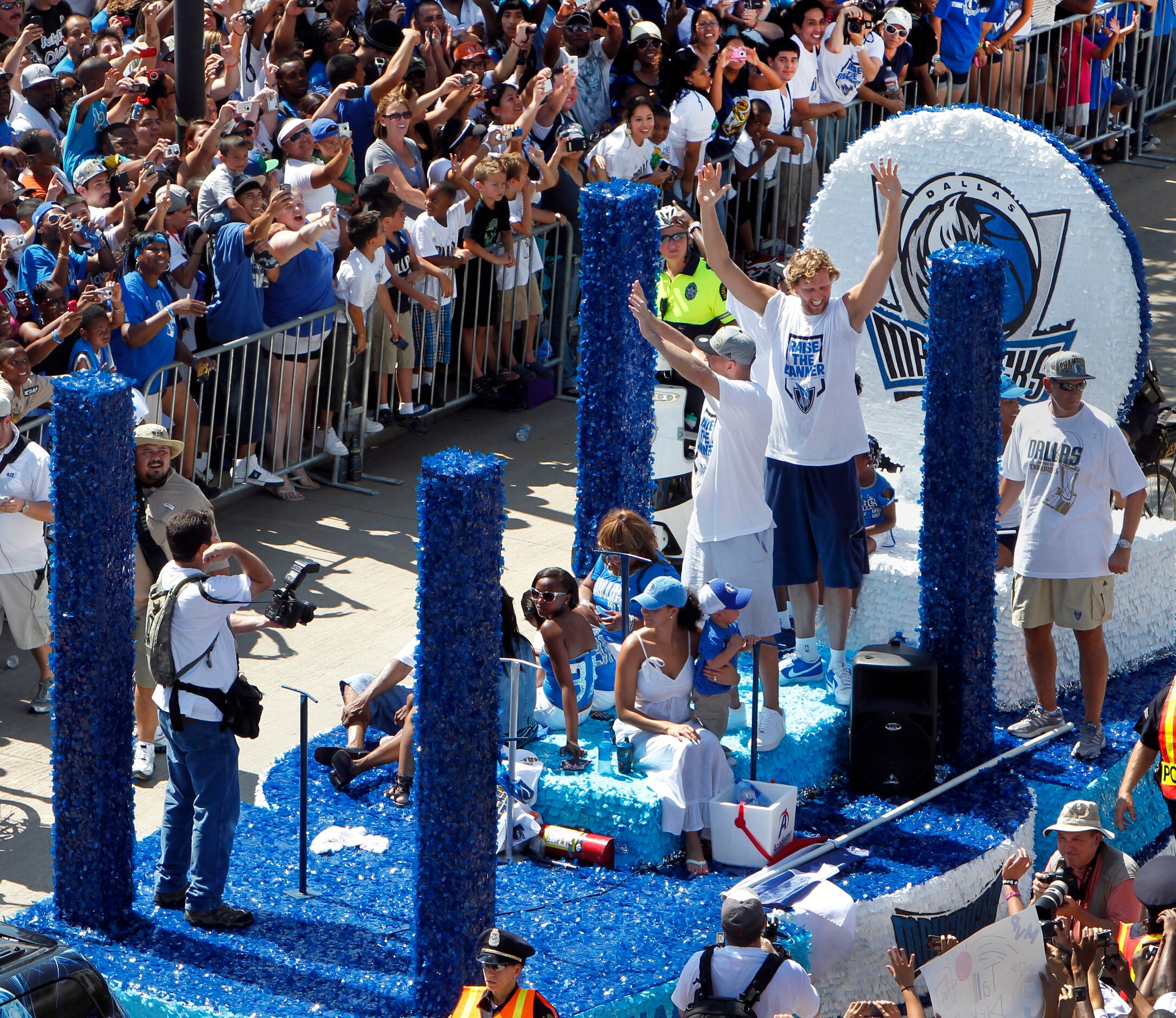 FOR BLOG POST -- Dallas Maverick fans cheer as their teams captains Dirk Nowitzki, Jason...