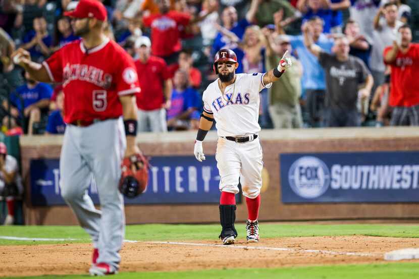 Texas Rangers second baseman Rougned Odor (12) disputes a call that he was out at first...