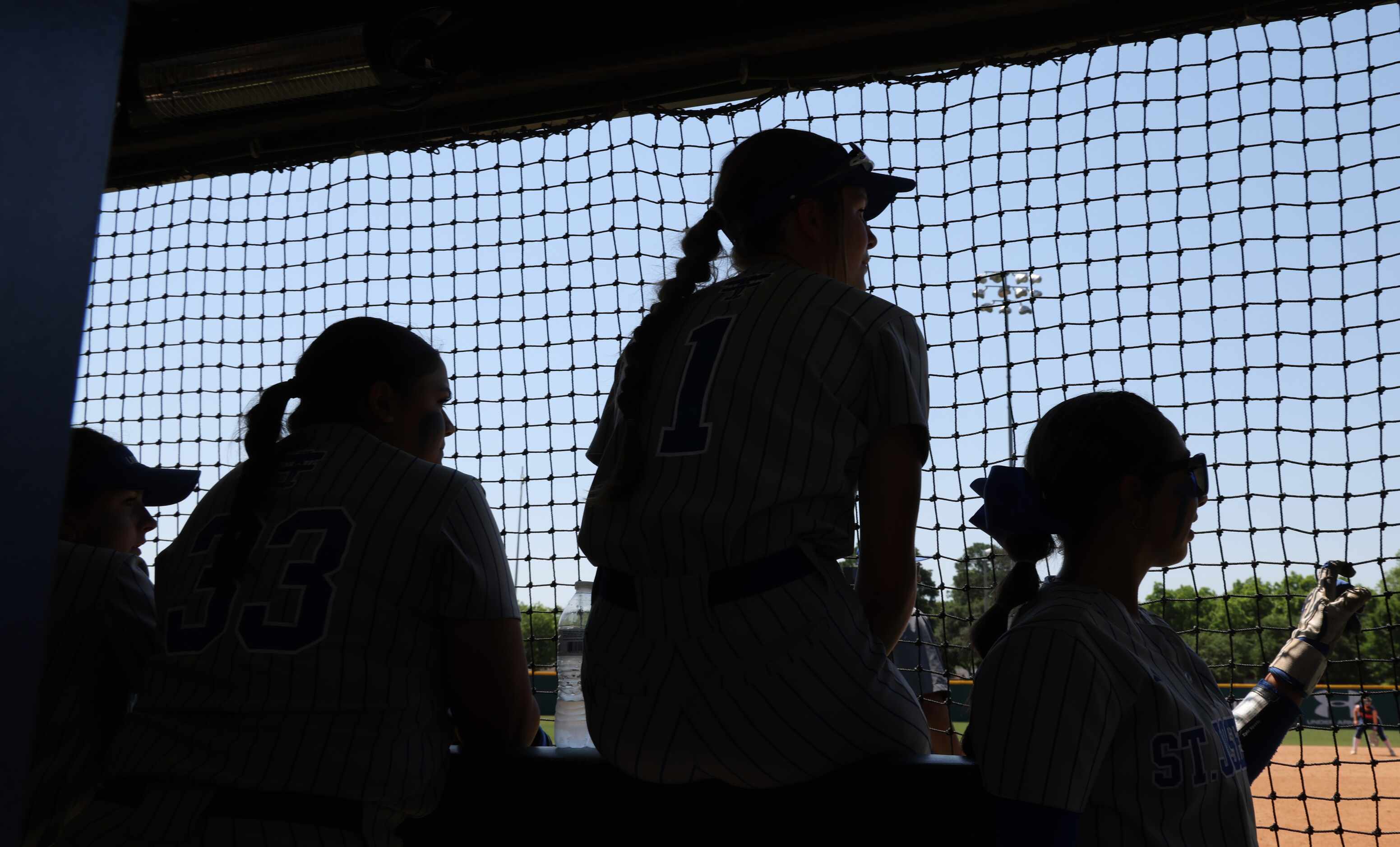 Victoria St Joseph players look on from there team dugout during 4th inning play against...