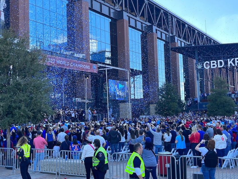 Confetti falls across the stage and crowd after the Texas Rangers World Series Victory...