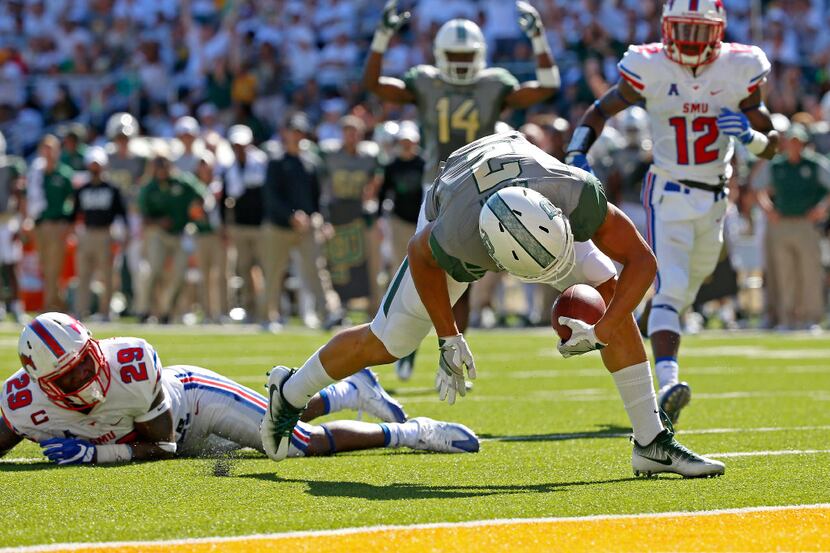 Baylor wide receiver Blake Lynch (2) fumbles the ball at the goal line after being tackled...