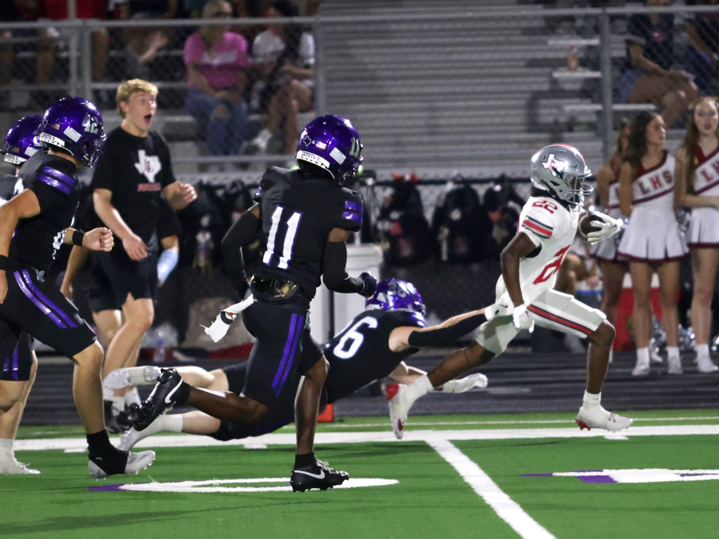 Lovejoy player #22 Zach Jones breaks free from Anna player #26 Damarion Gaston for a...