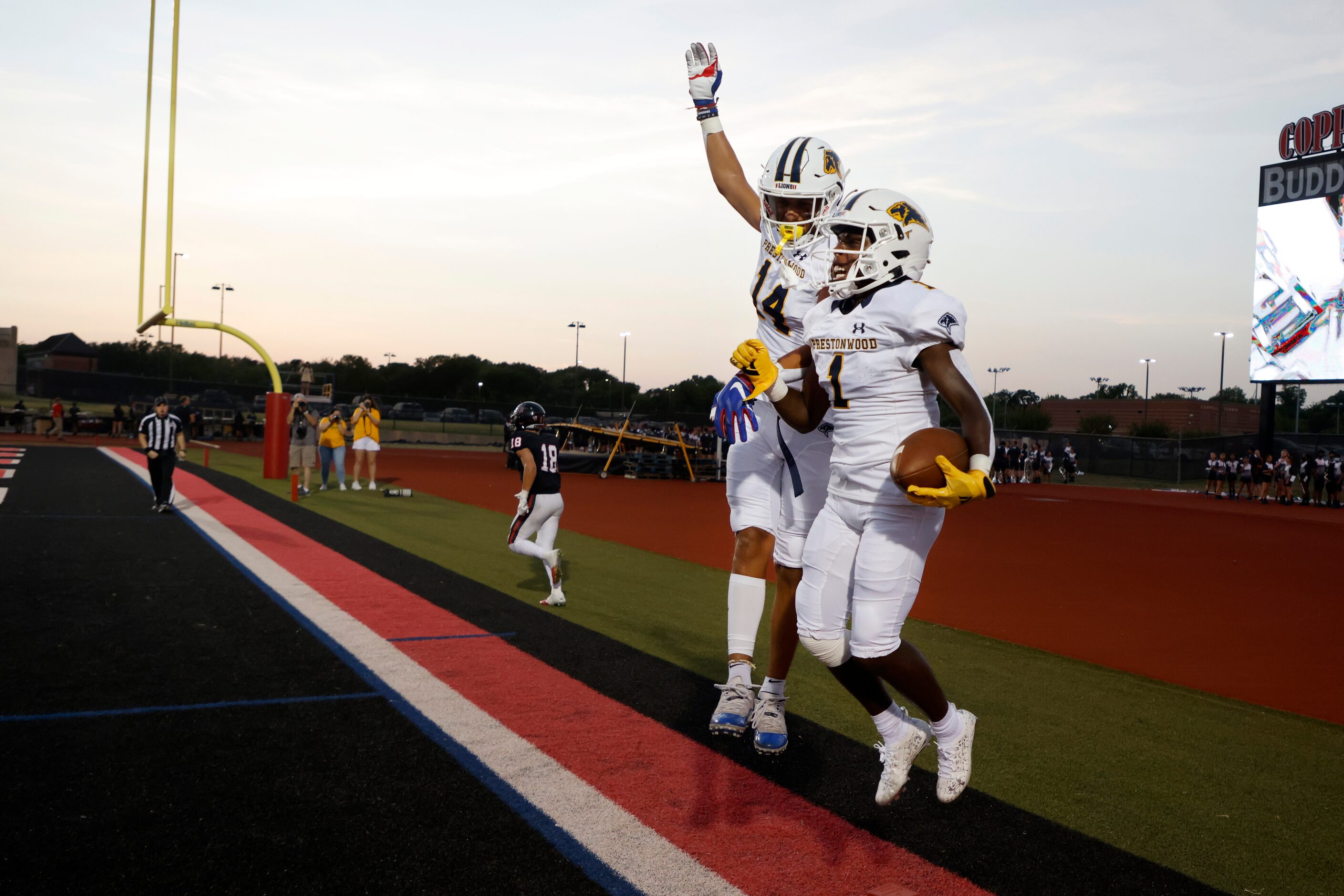 Prestonwood Christian Academy receiver Nate Stafford (1) celebrates his touchdown reception...