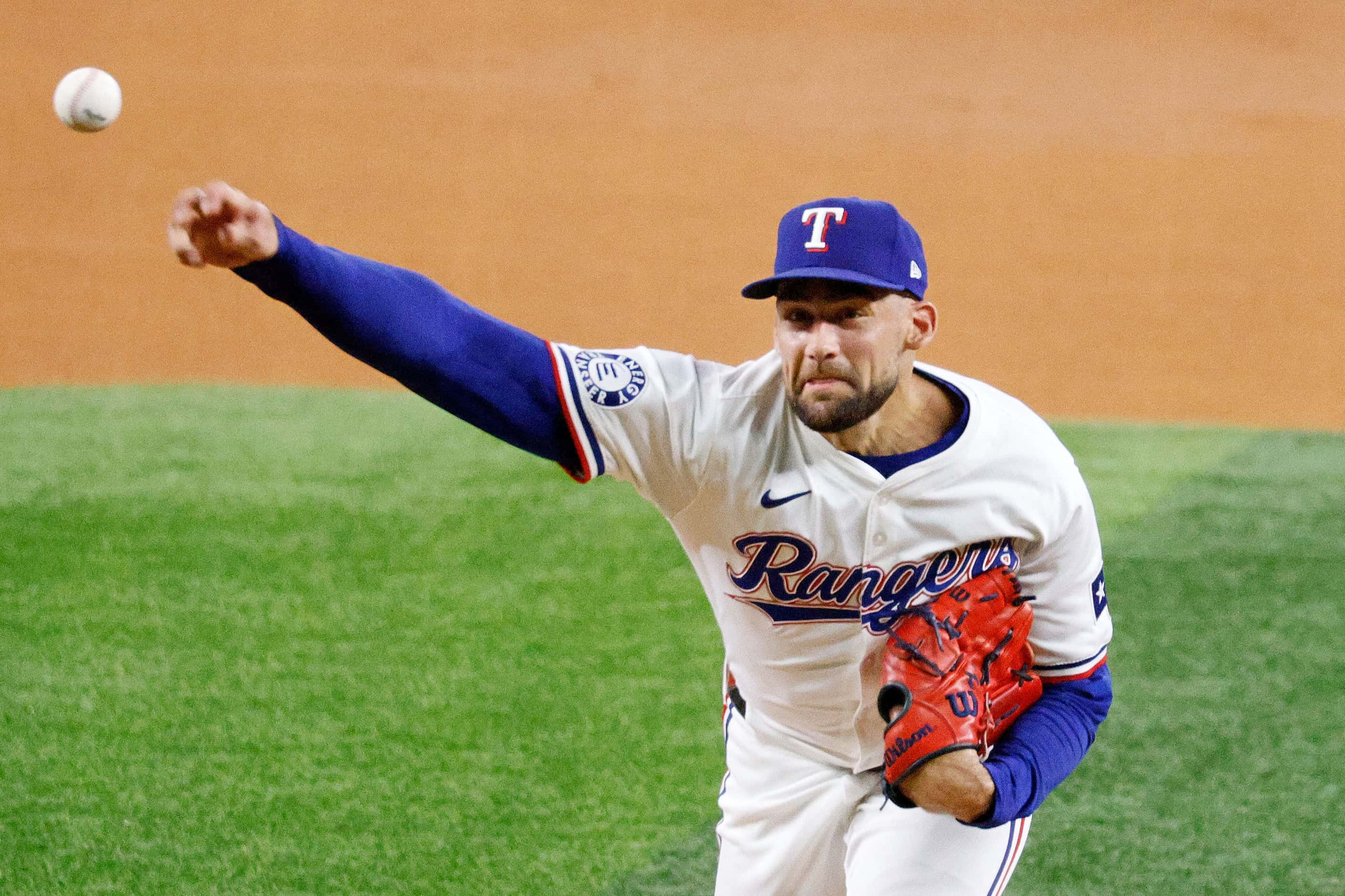 Texas Rangers pitcher Nathan Eovaldi (17) delivers during the first inning of a baseball...