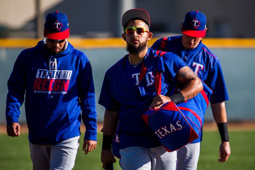 Texas Rangers second baseman Rougned Odor (12) leads his teammates on to the field before a...