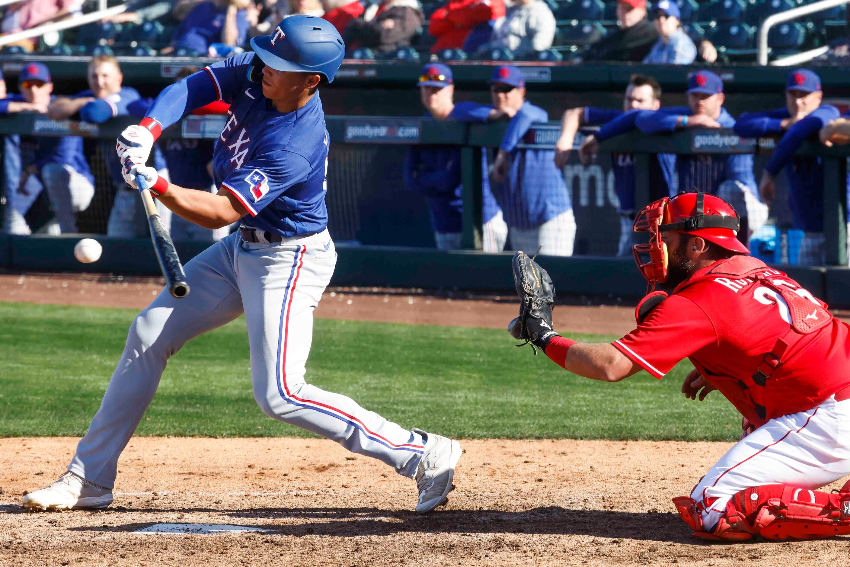 Texas Rangers outfielder Dustin Harris hits during the ninth inning of a spring training...