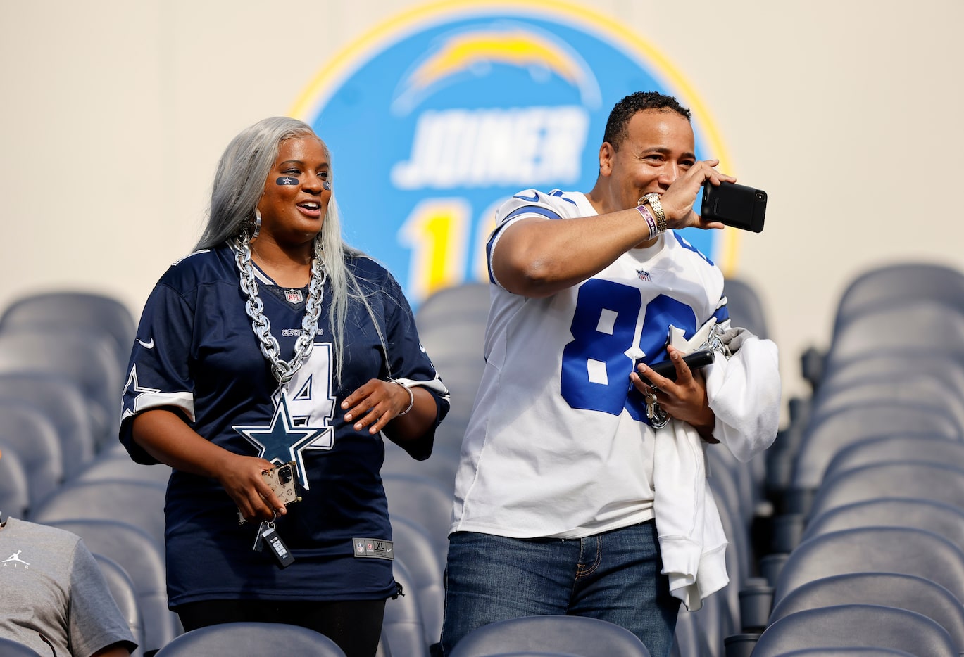 Dallas Cowboys fans take photos of pregame warmups as they arrive for the Los Angeles...