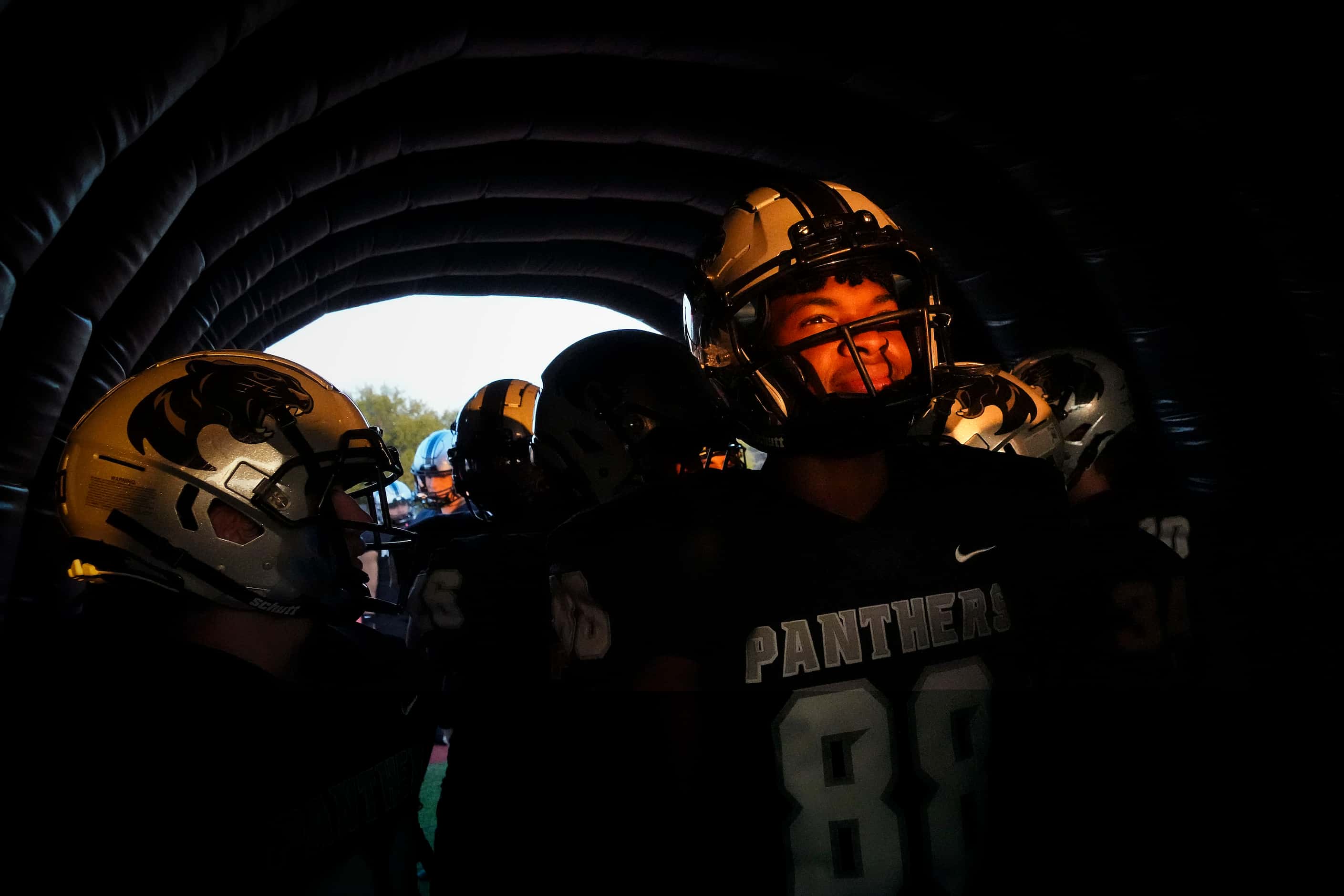 Panther Creek’s Sean Henry (88) waits in the tunnel with teammates to take the field before...