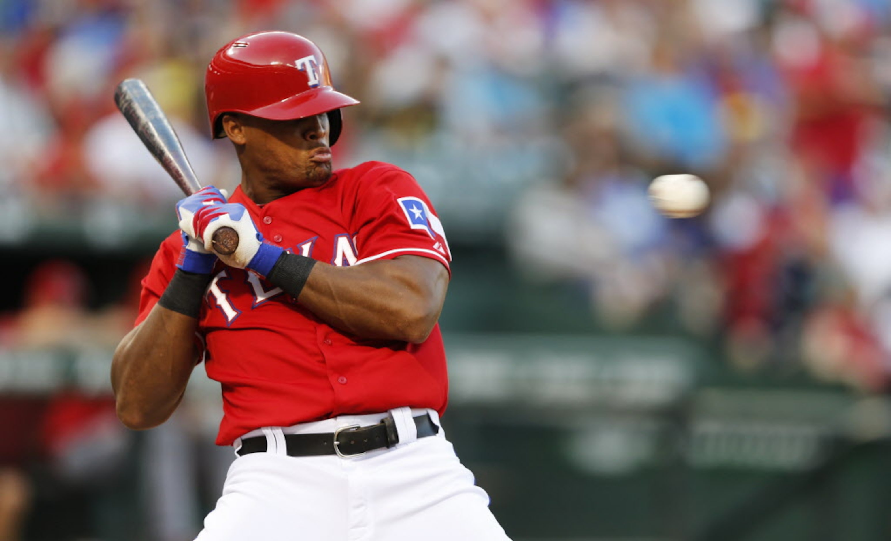 Texas Rangers third baseman Adrian Beltre (29) leans back from a ball during the sixth...