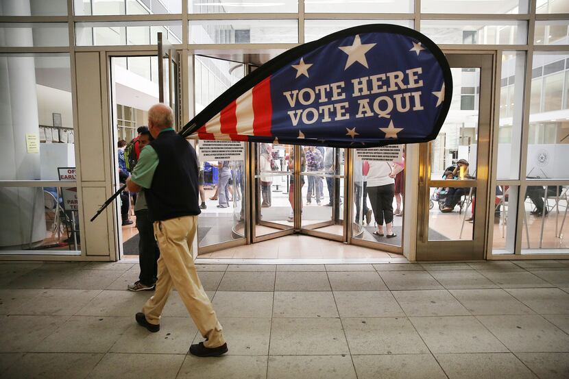Election official Jimmy Murphy helped as workers wrapped up early voting last November at...