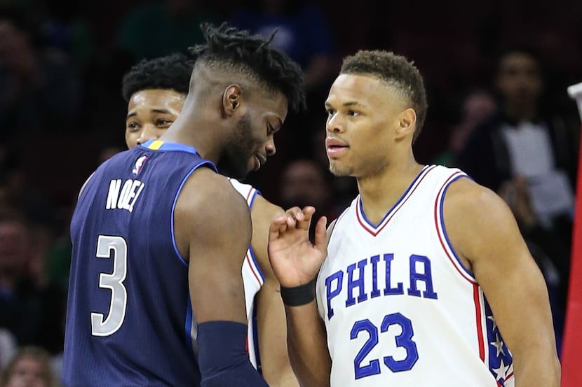 The Philadelphia 76ers' Justin Anderson (23) chats with the Dallas Mavericks' Nerlens Noel...