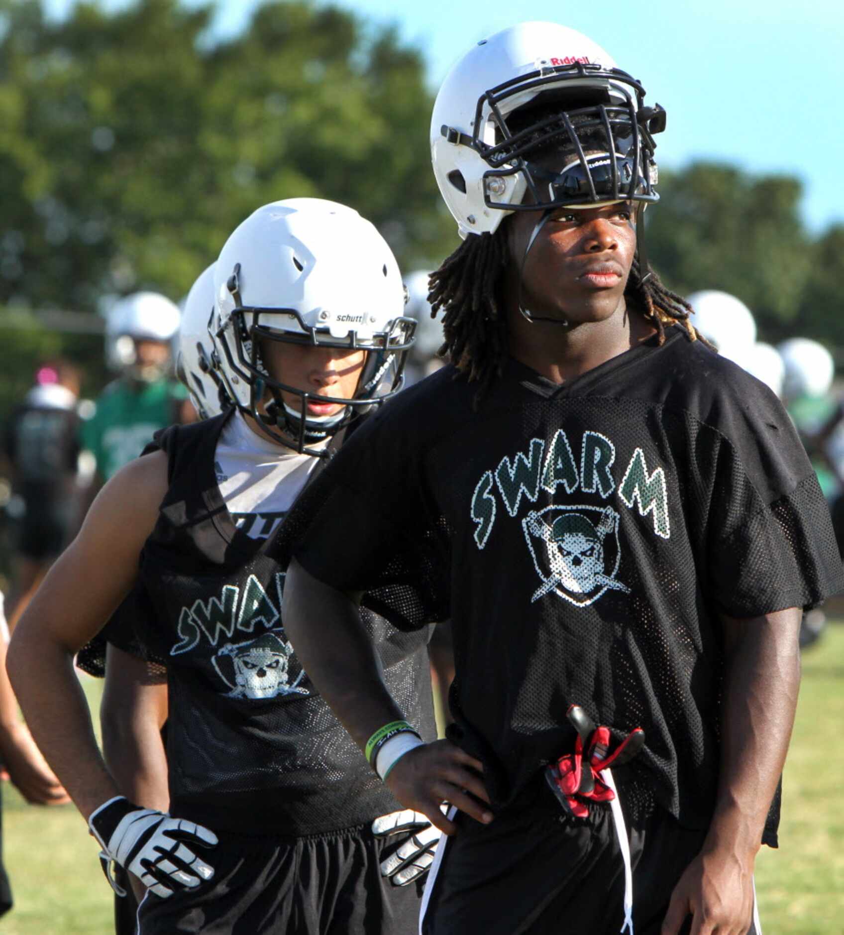 Mesquite Poteet linebacker Malik Jefferson raises his helmet and waits his turn with other...