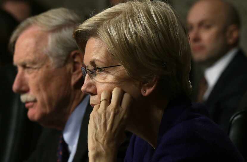 U.S. Sen. Angus King (ID-ME) (L) and Sen. Elizabeth Warren (D-MA) (2nd L) listen during a...