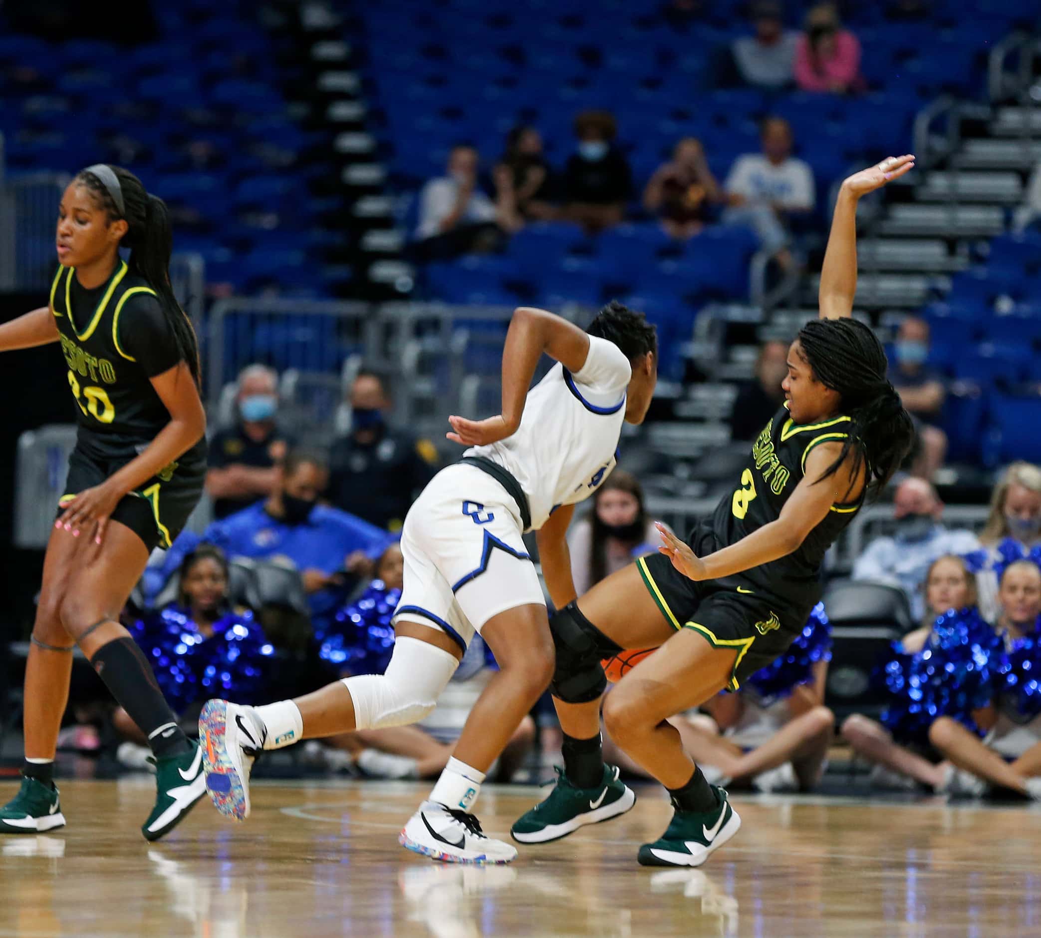 DeSoto Kayla Glover #3 tries to force a charge. DeSoto vs. Cypress Creek girls basketball...