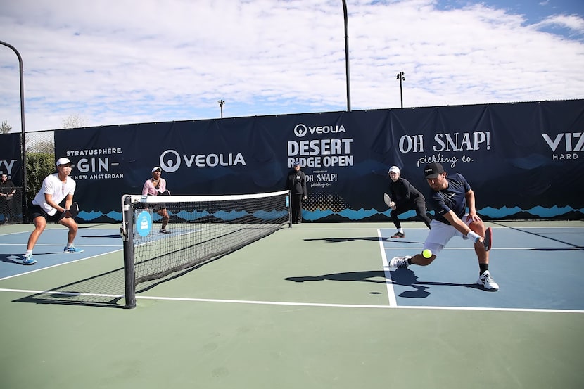 Professional pickleball athletes Augie Ge and Tyra Black play against Vivienne David and...