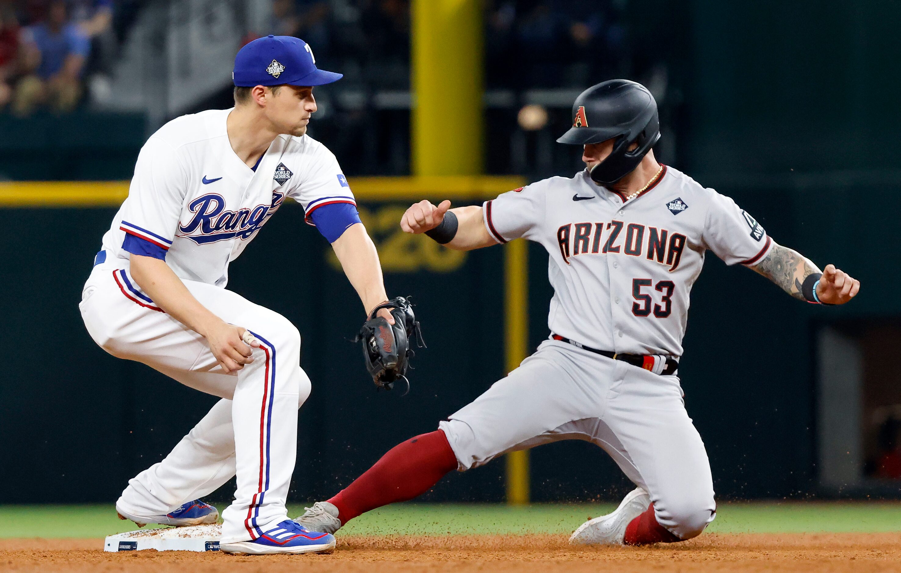 Arizona Diamondbacks Christian Walker (53) is out at second on a fielder’s choice to Texas...