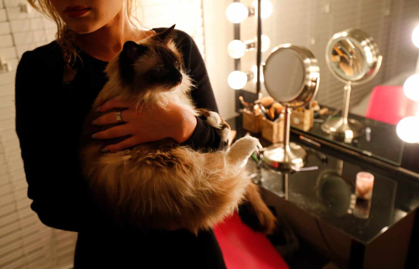The victim was photographed with her cat in 2017 while her Title IX complaint against...