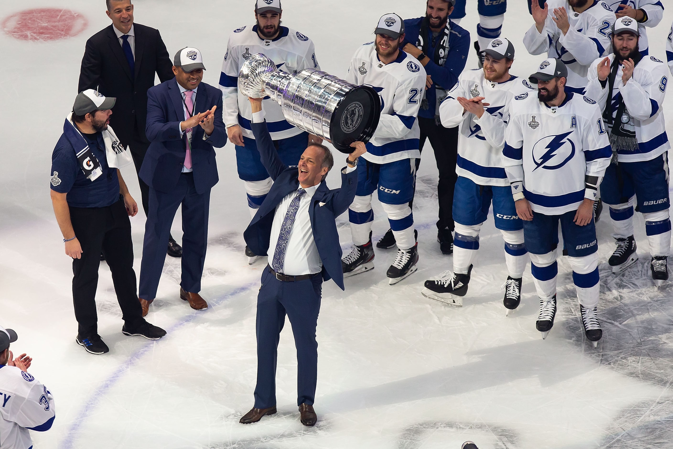 Head coach Jon Cooper of the Tampa Bay Lightning hoists the Stanley Cup after defeating the...