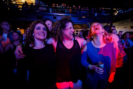 Meryl Evans (center) laughs with her friends Jennifer Peterson (left) and Jennifer Sheiner...