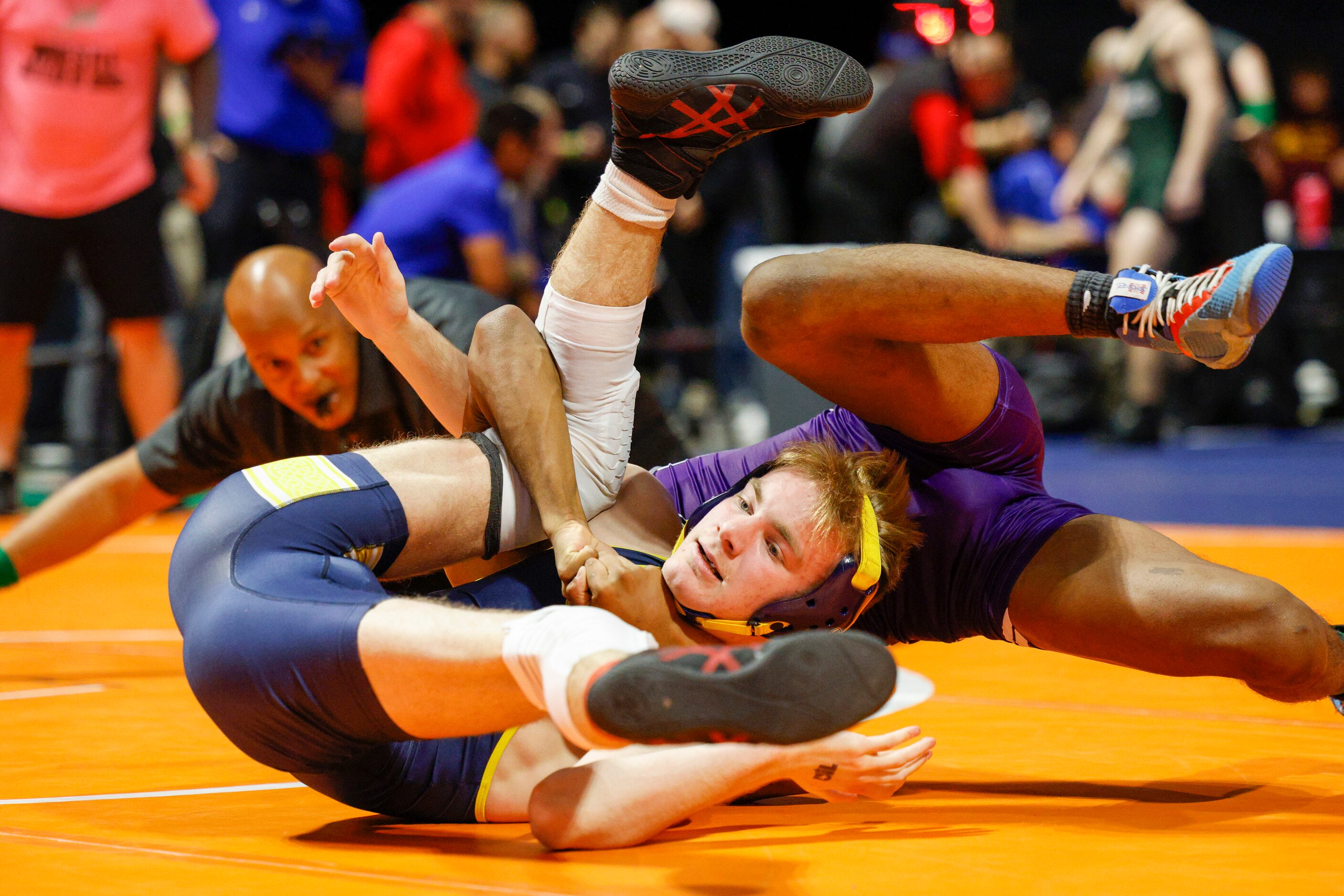 Kyle Lairson of Arlington Lamar wrestles Talim Hussain of Klein Cain during a second round...