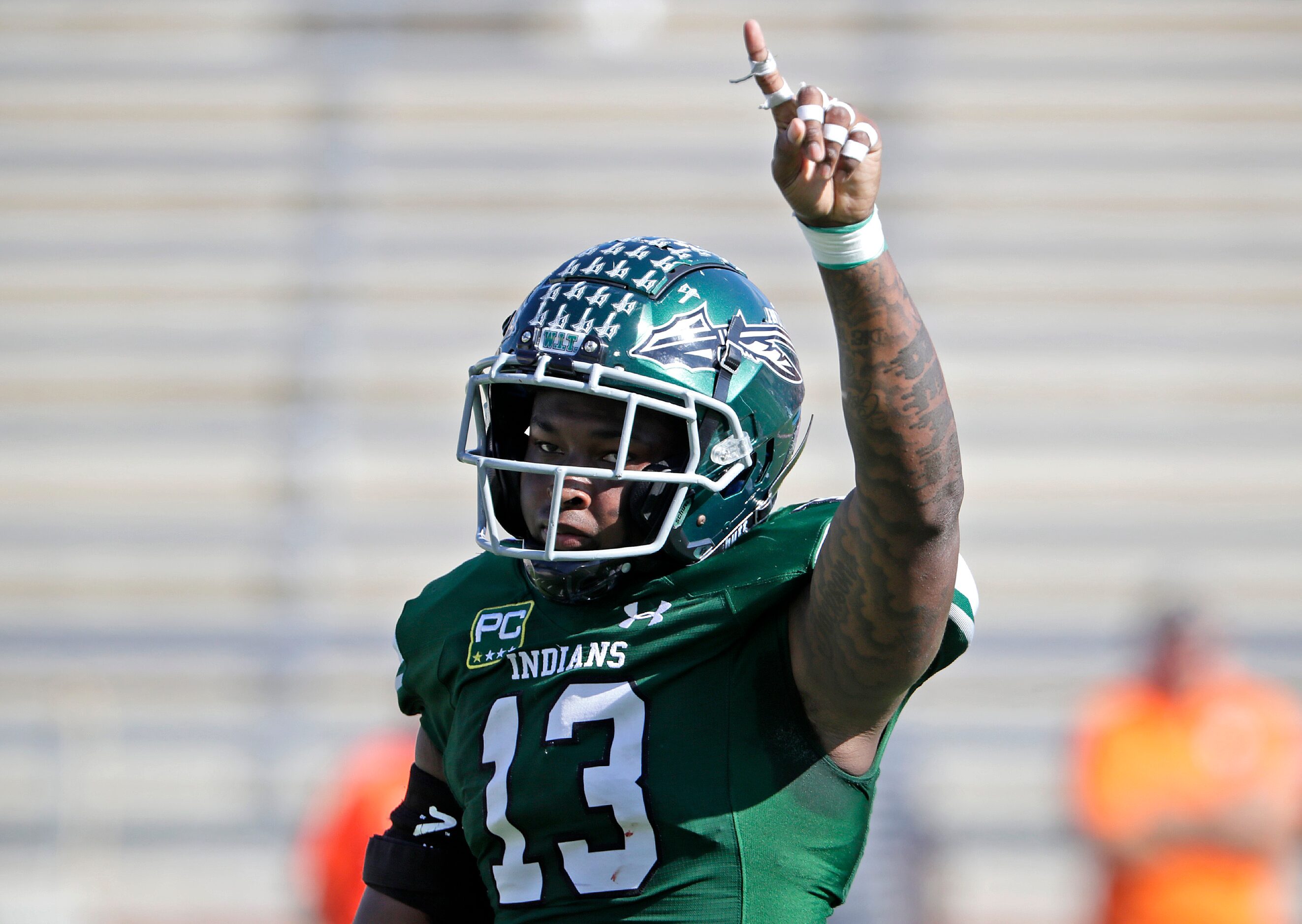 Waxahachie High School defensive end Jermy Jackson Jr. (13) celebrates a sack on third down...