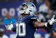 Dallas Cowboys defensive end DeMarcus Lawrence (90) celebrates his first quarter sack of New...