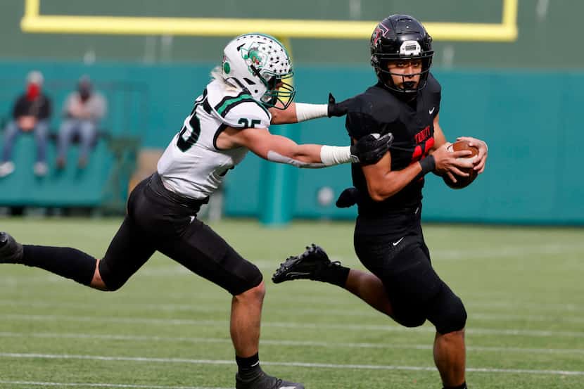 FILE — Southlake Carroll defender Barrett Baker (25) chases Euless Trinity receiver Carey...