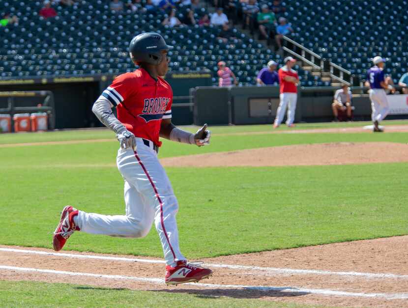 McKinney Boyd's sophomore Tyler Collins (7) runs towards first base during their game...