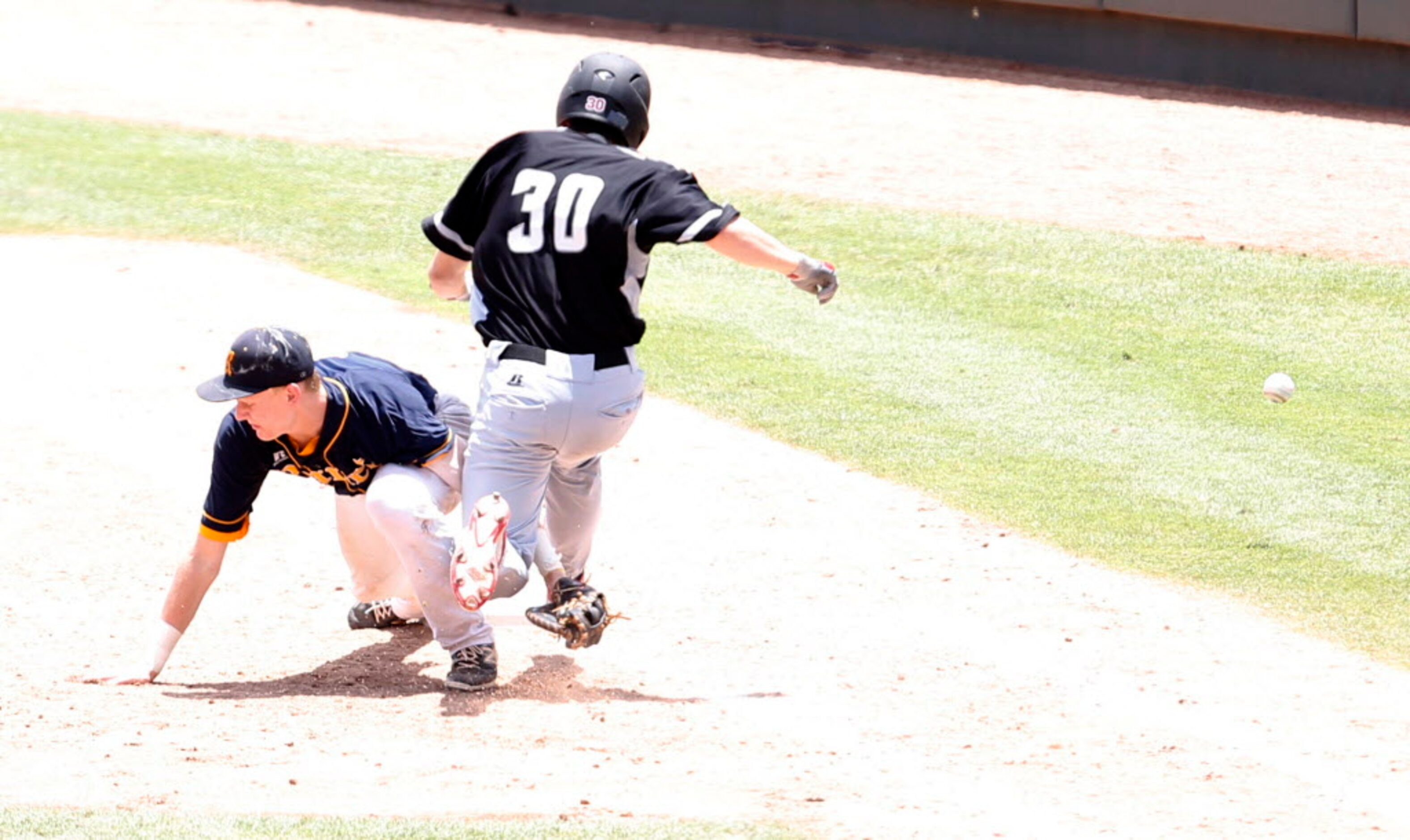 Martin's Nathan Soroka (30) safely makes it to first base after Cypress Ranch's Garrett...