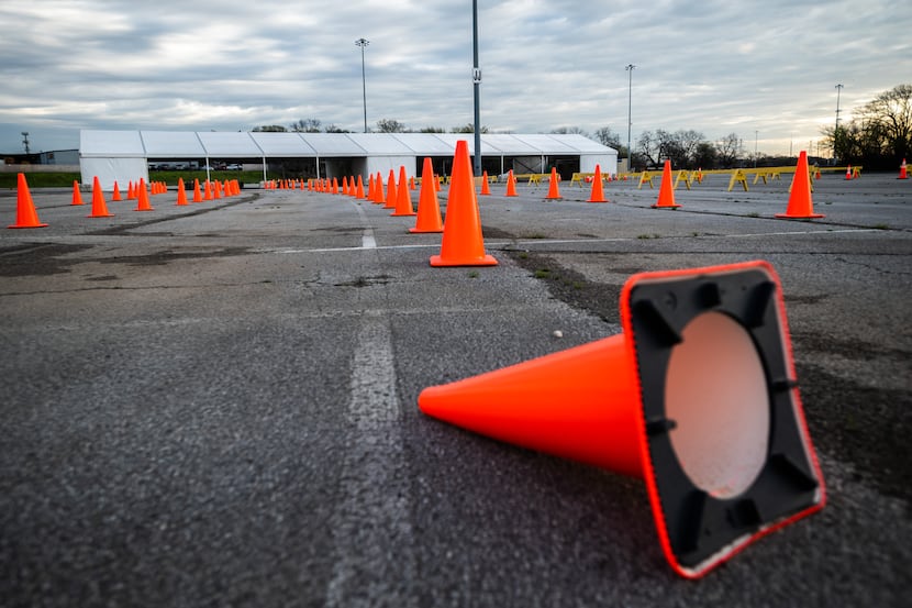 Empty rows of traffic cones at Fair Park's COVID testing and vaccination site in Dallas, on...
