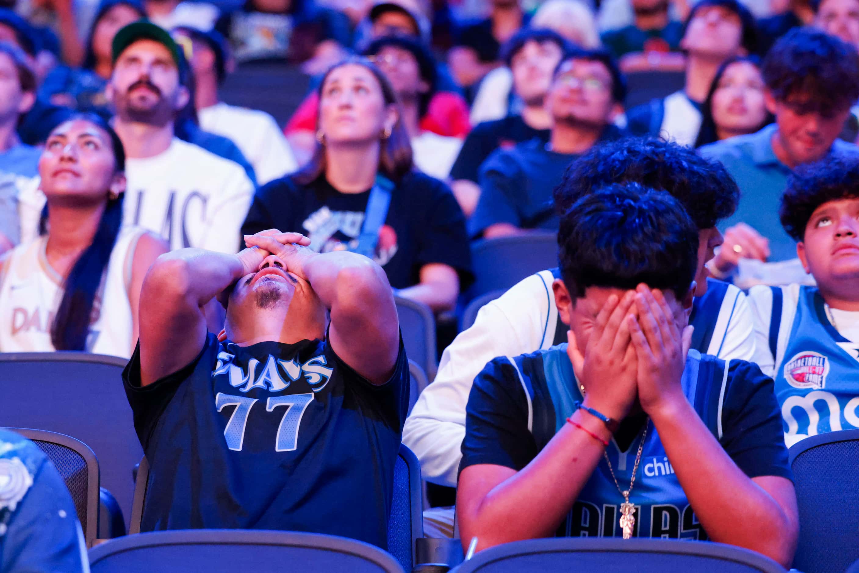 Dallas Mavericks fans look dejected followed by the teams’ falling short in the second...