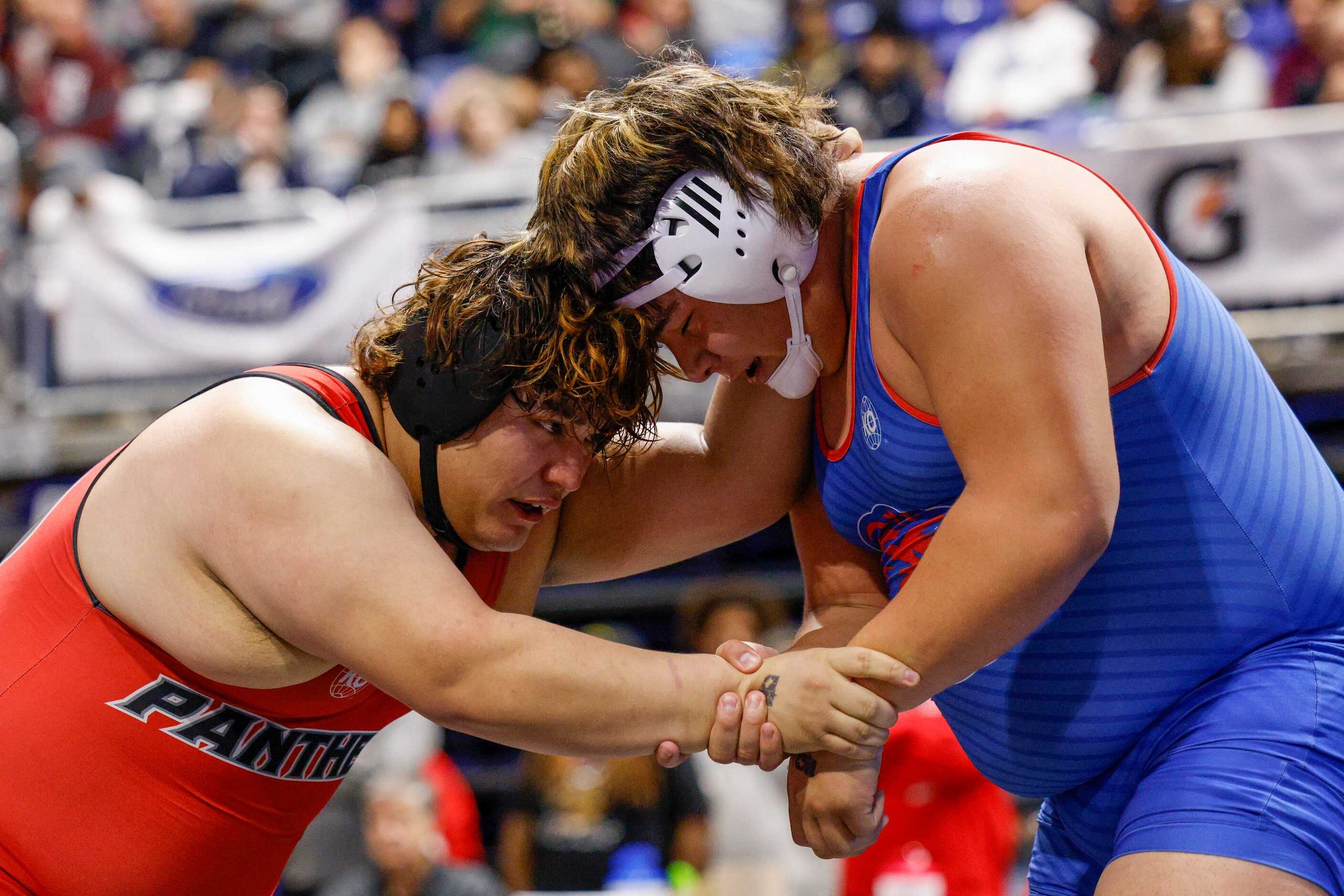 Americo Fuentes of Hillcrest wrestles Phillip Saenz of Leander during a quarterfinal match...