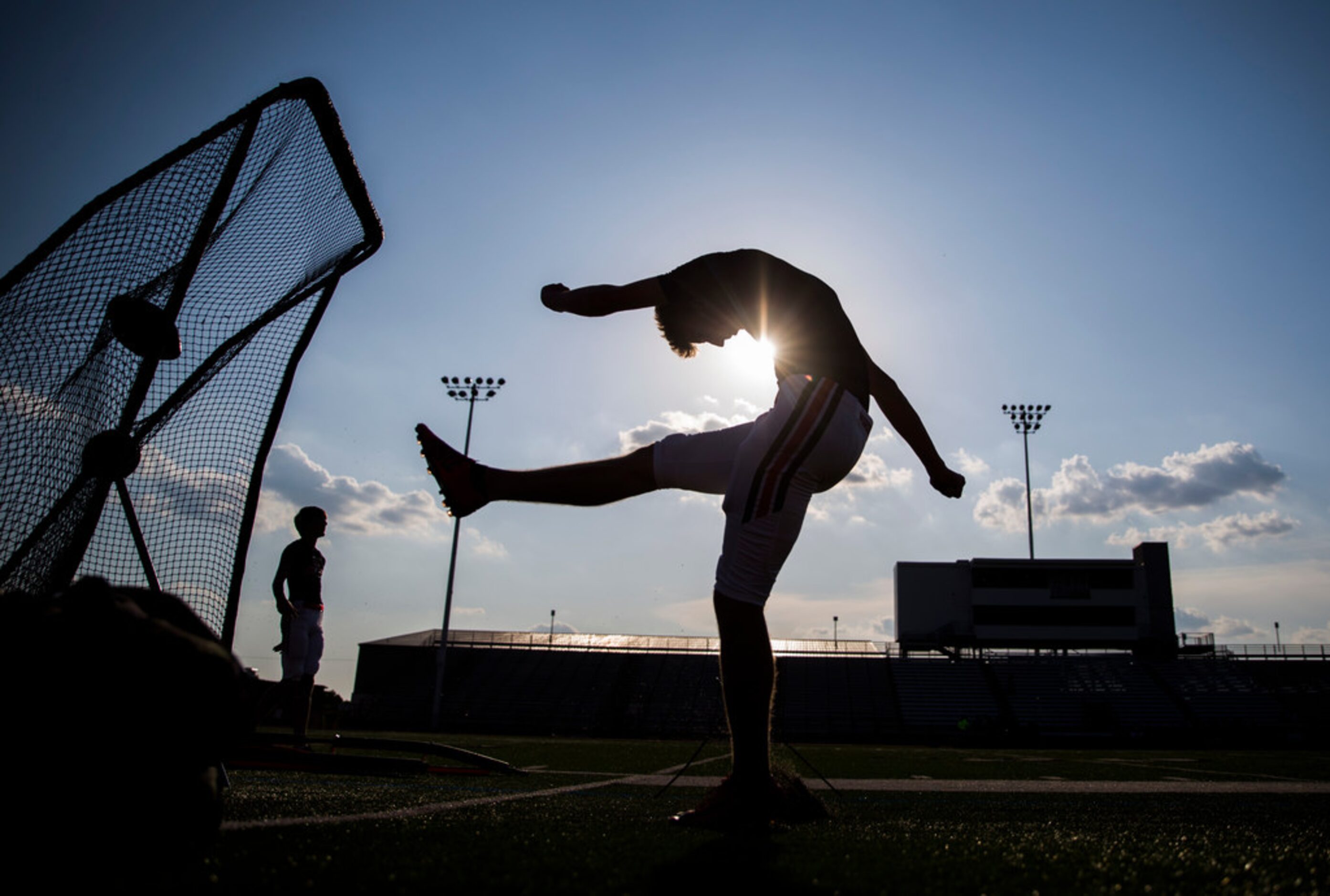 Flower Mound Marcus kickers warm up before a high school football game between Flower Mound...