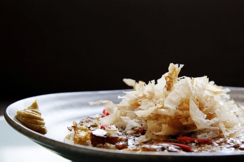Okonomiyaki, a Japanese seafood pancake at Tei-An in Dallas. The dish, popular in Osaka and...