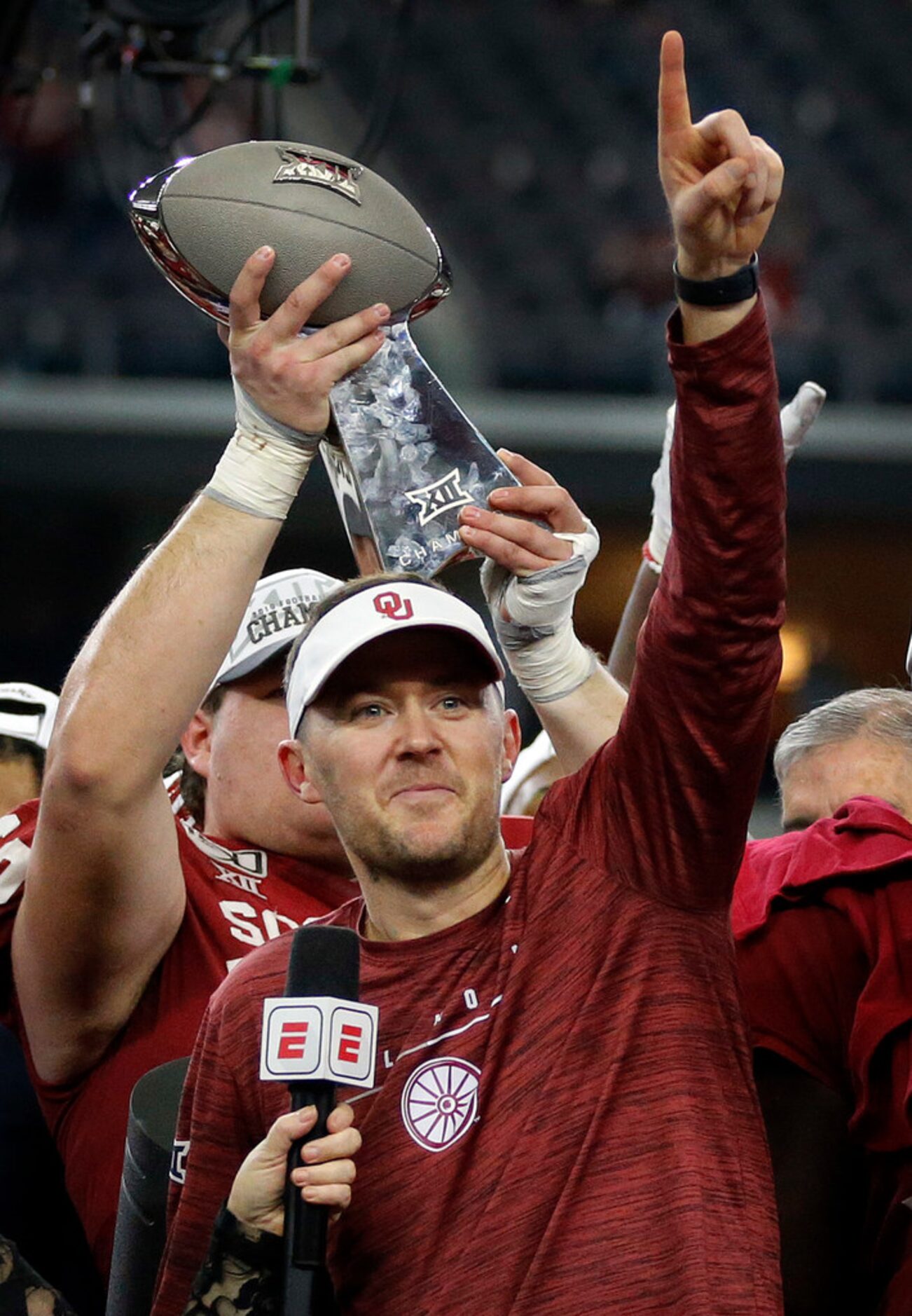 Oklahoma Sooners head coach Lincoln Riley celebrates his team's Big 12 Championship win over...