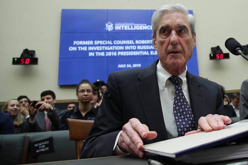Former Special Counsel Robert Mueller waits to testify before the House Intelligence...