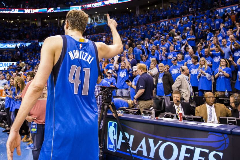 Dallas Mavericks forward Dirk Nowitzki (41) gives the Oklahoma City Thunder crowd a thumbs...