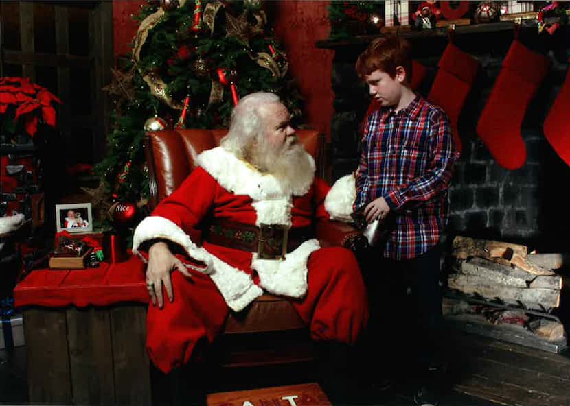Benjamin Philyaw with Carl Anderson, who portrays Santa at NorthPark Center.
