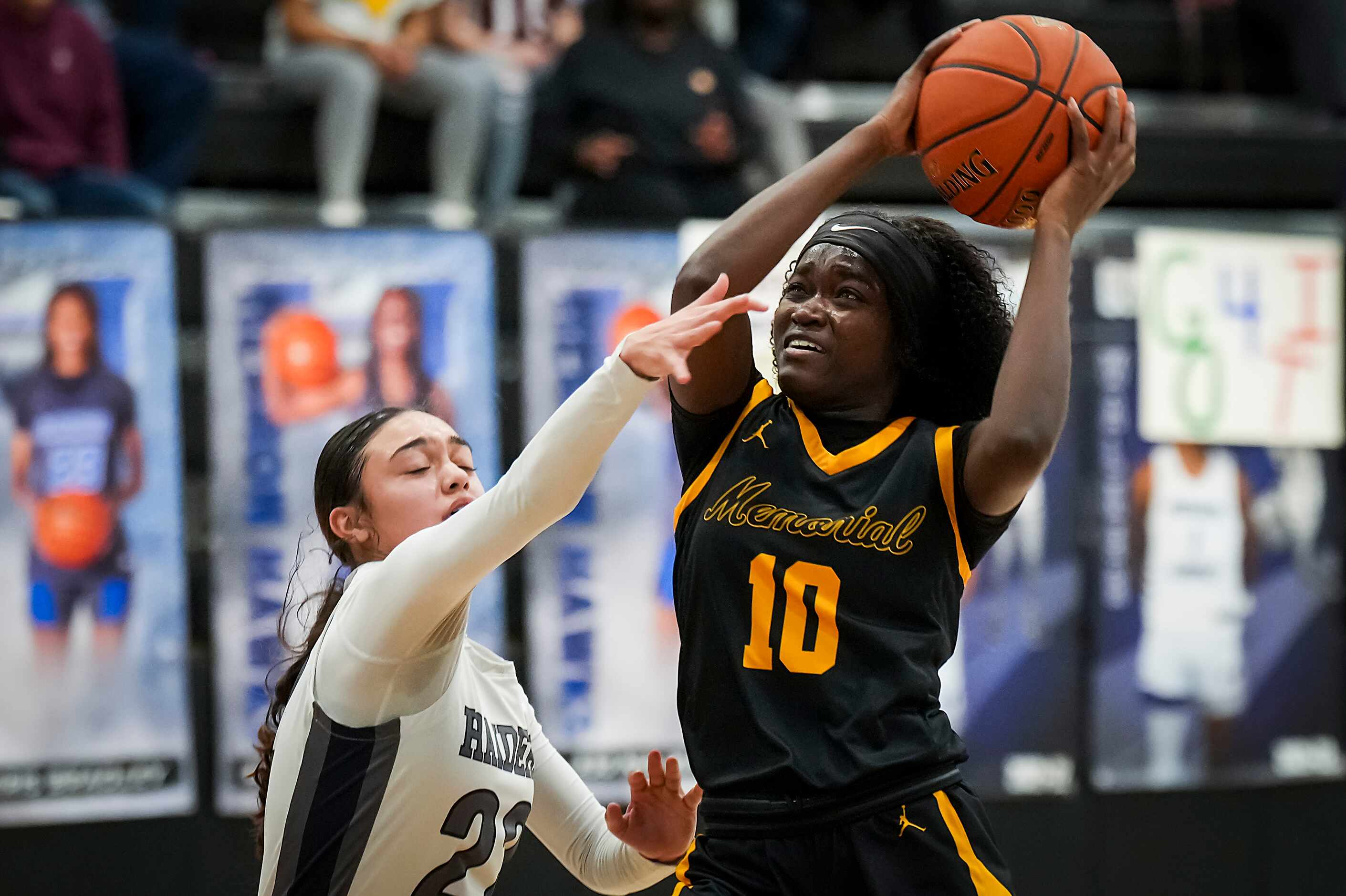 Frisco Memorial's Jasmyn Lott (10) drives to the basket past Wylie East's Aaliyah Halstied...