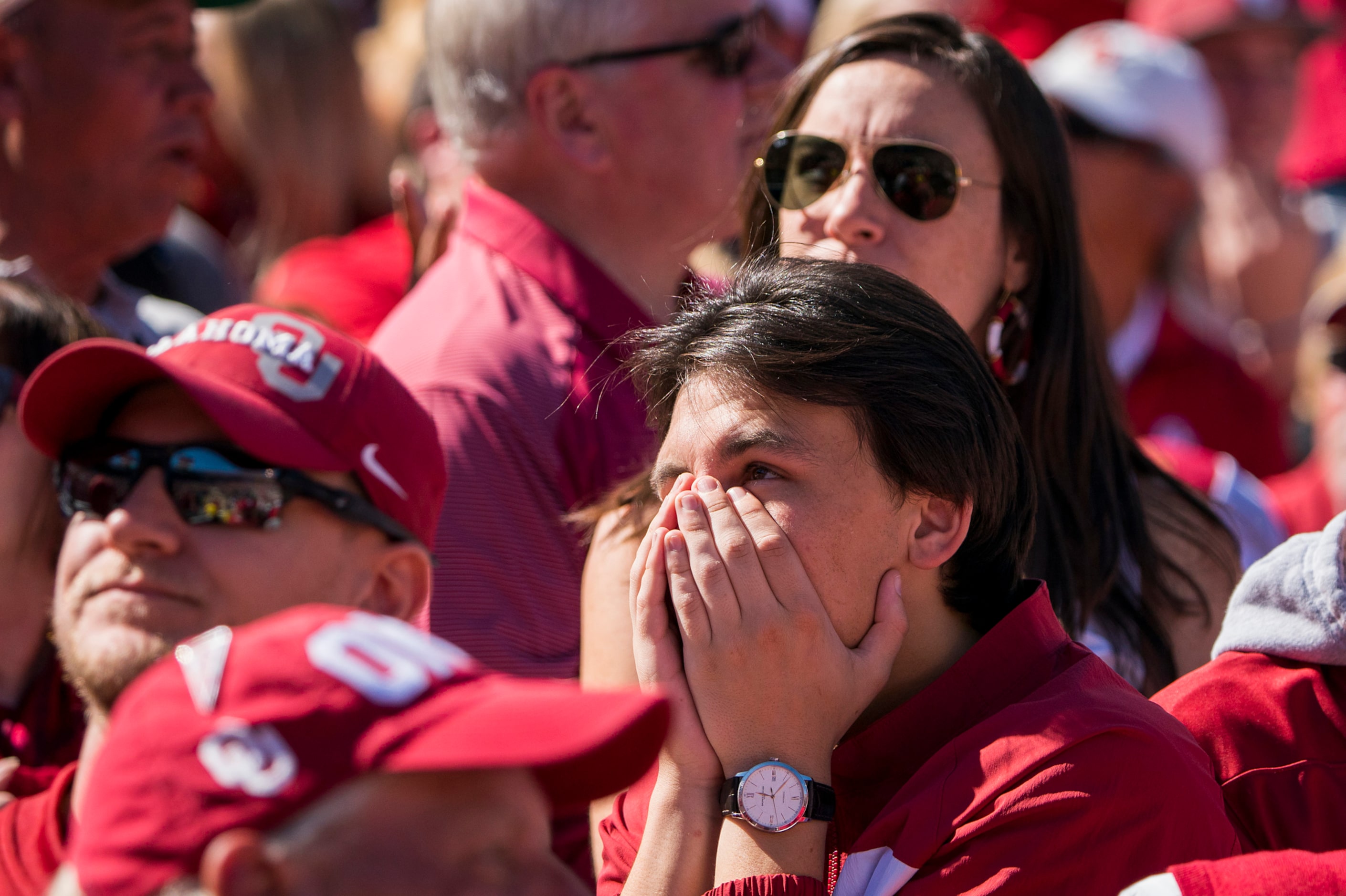 Oklahoma fans react after turnover during the first half of an NCAA football game against...