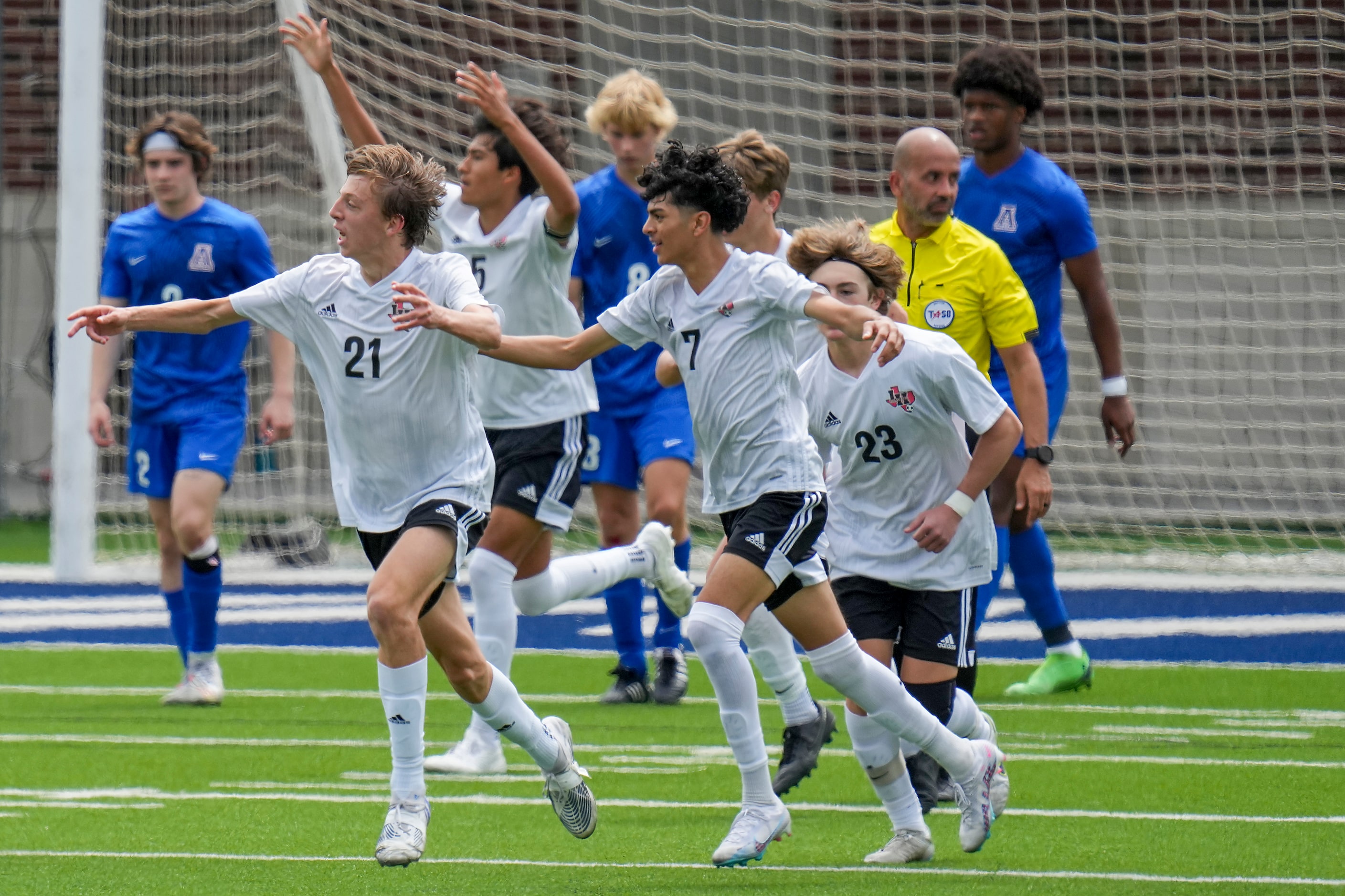 Lake Highlands midfielder James Boone (21) celebrates with midfielder Kerry Najera (7) ...