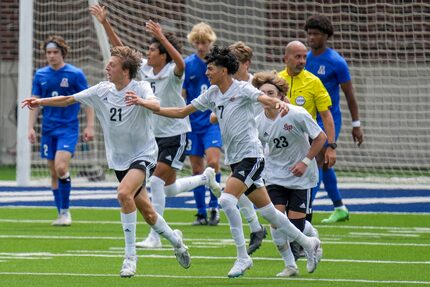 Lake Highlands midfielder James Boone (21) celebrates with midfielder Kerry Najera (7) ...