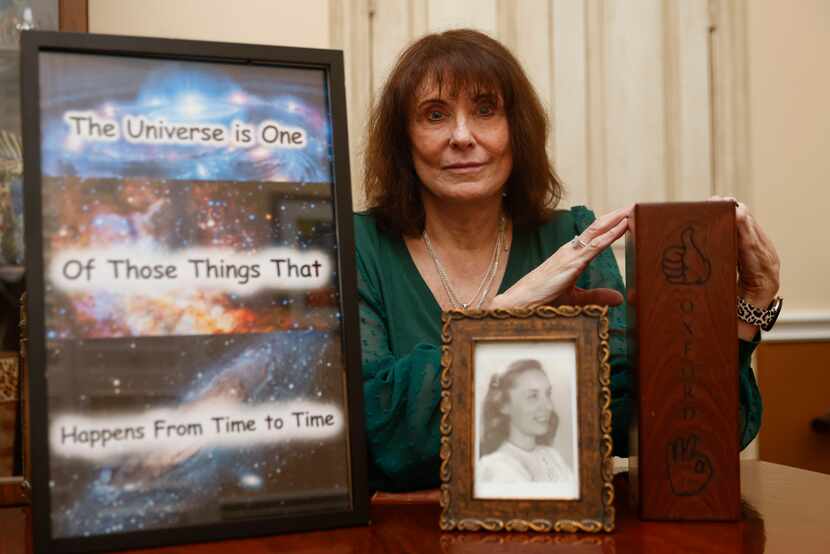 Dr. Terri Howard-Hughes poses with a photo of her mother,  Angela J. Burke’s memorabilia, on...