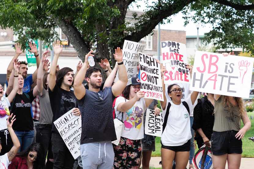 Demonstrators rallied last week in Denton against the state's sanctuary cities ban. (Jeff...