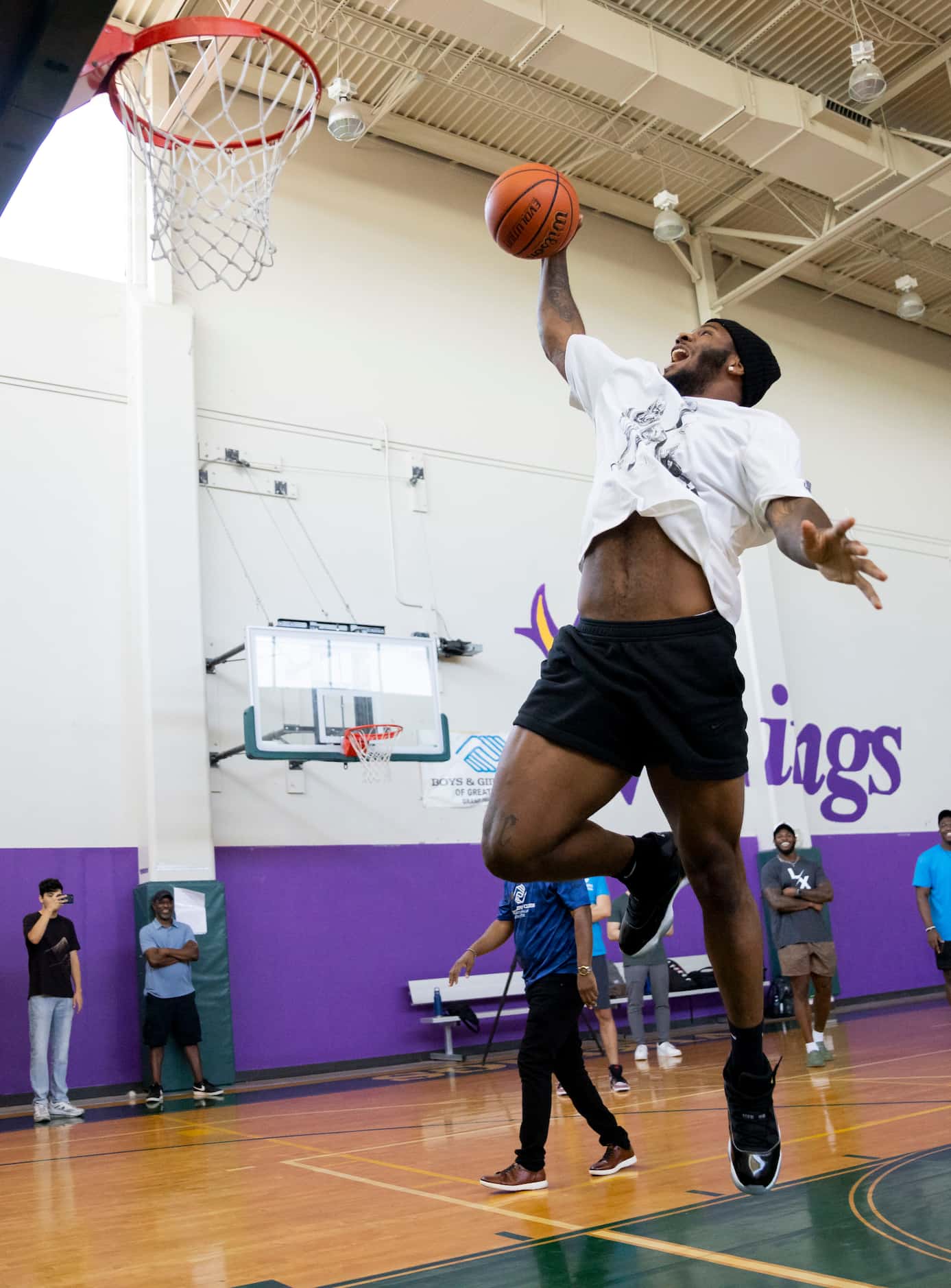 Dallas Cowboys linebacker Micah Parsons (11) dunks the ball during a game of knockout with...