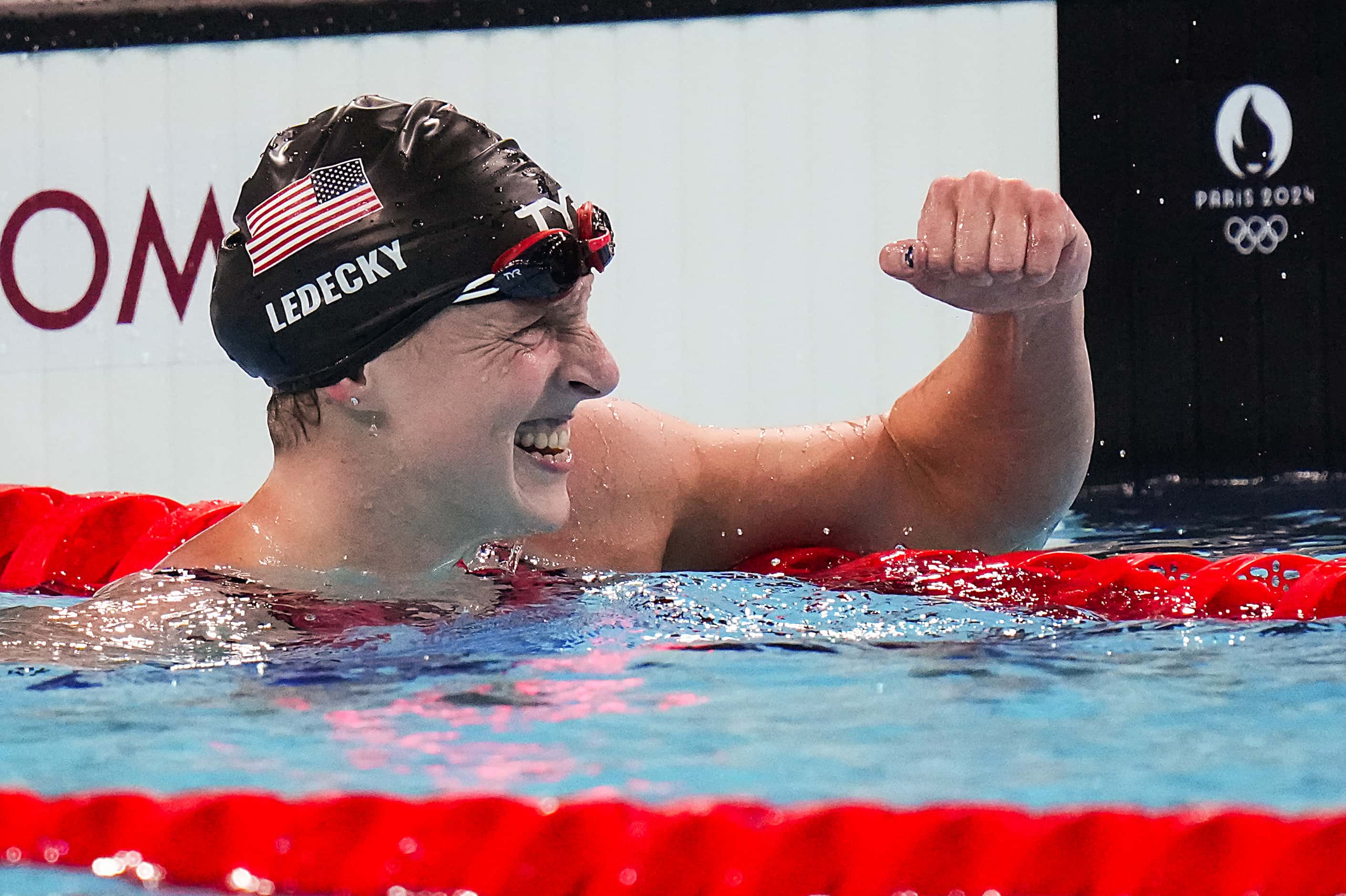 Katie Ledecky of the United States celebrates after winning the women's 1500-meter freestyle...