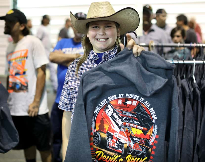 11-year-old Case Shaw purchases a commemorative hoodie at Devil's Bowl Speedway in Mesquite....
