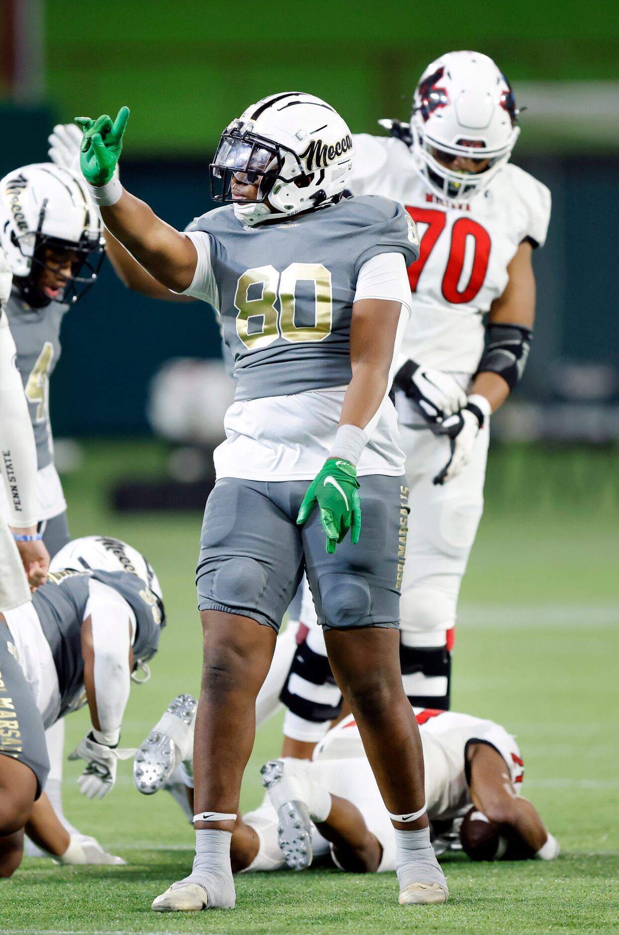 South Oak Cliff defensive lineman Keith Smith (80) wags his finger after tackling Melissa...