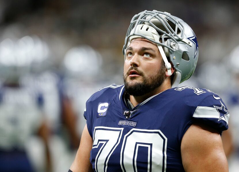 Dallas Cowboys offensive guard Zack Martin (70) looks up as he exits the field after warmups...